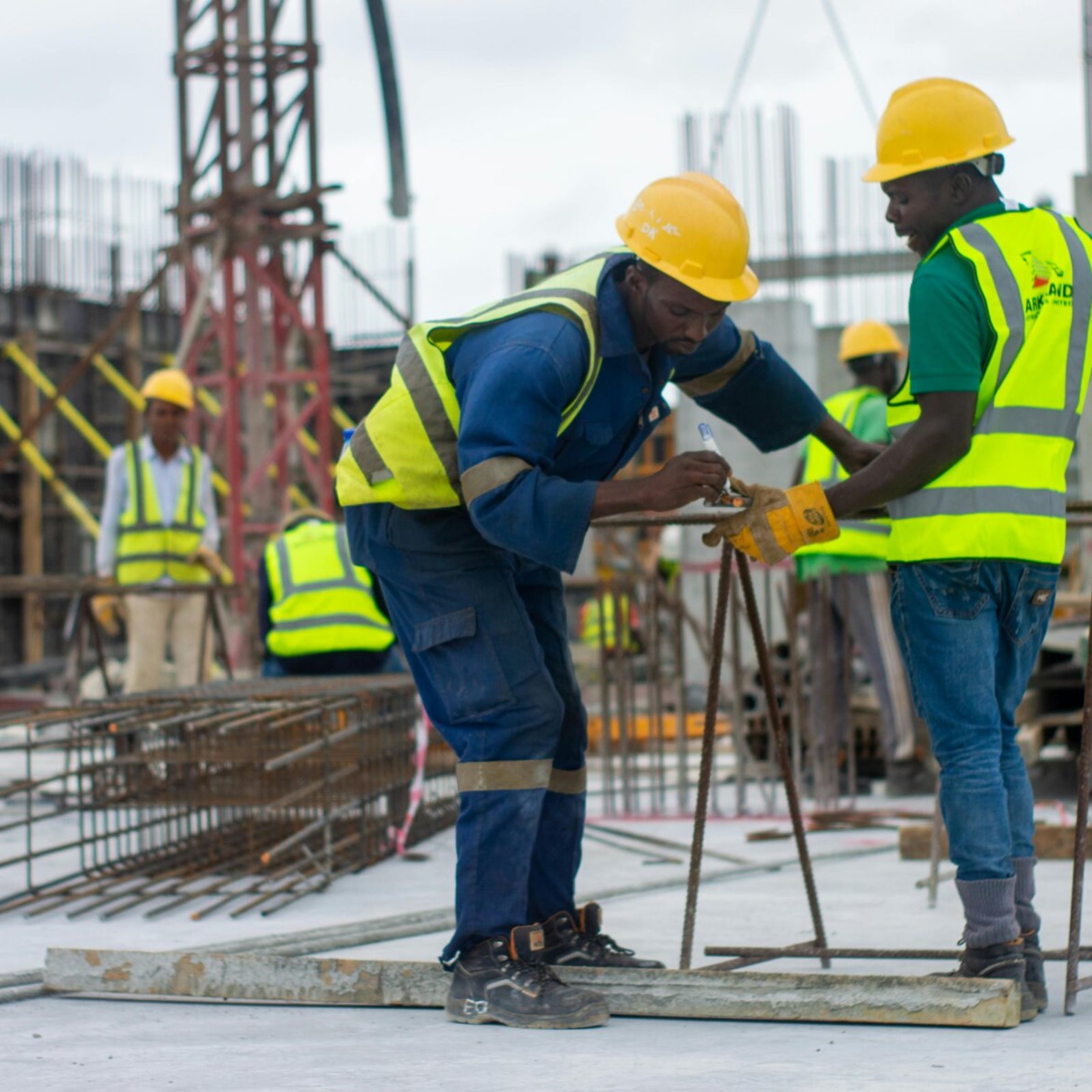 Construction workers collaborating on site